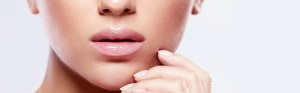 woman embracing her face emphasizing lips