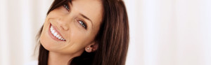 brunette with blue eyes smiling