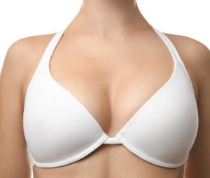 Woman's chest wearing white bra 